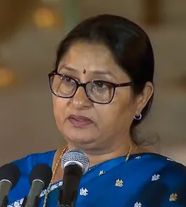 Close view of Annpurna Devi speaking into a microphone during the swearing-in